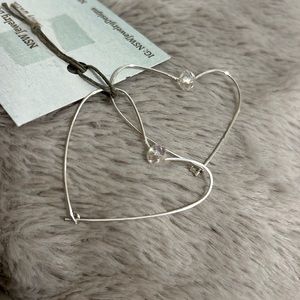 Dainty heart shaped hoop earrings with crystal